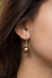 Light brown pearly bead earring.