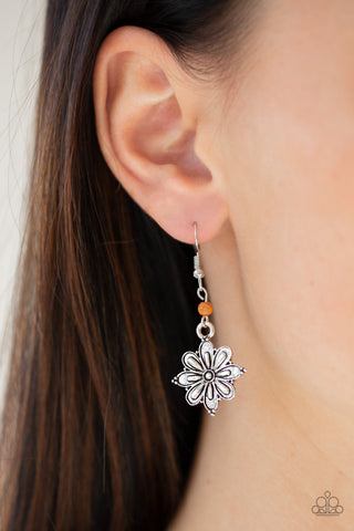 Silver flower dangle earring with an orange stone