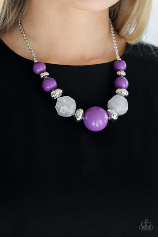 silver chain necklace with purple beads, silver beads, and cloudy beads gradually increasing in size towards center